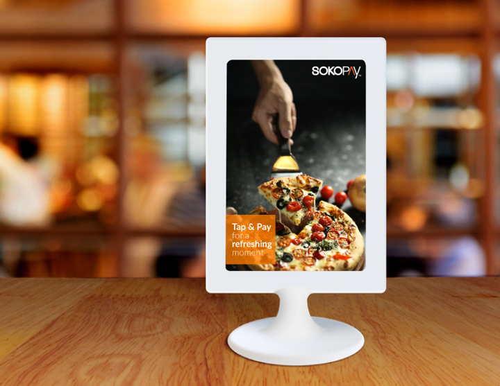 SokoPay Tap and Pay pizza campaign on a digital display